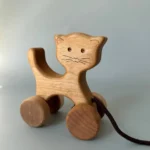 Wooden cat on wheels